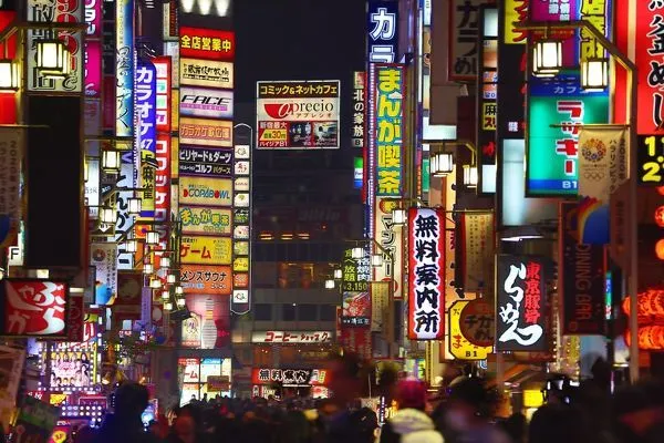 A busy street in Japan filled with signs competing for attention