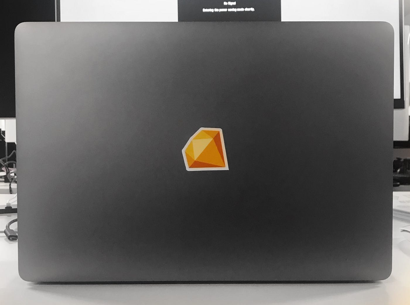 MacBook laptop with Sketch diamond sticker